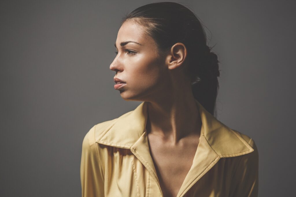 woman showing ear